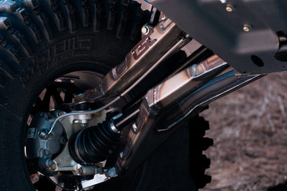 Close-up of a vehicle's suspension system with a blurred background